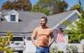 Man standing outside new american home. Handsome confident businessman in t shirt, looking up. Royalty Free Stock Photo