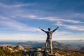 Man standing with raised hands on top of Table mountain in Cape Town Royalty Free Stock Photo