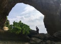 A man is standing in a rock cave Royalty Free Stock Photo