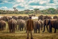 A man standing in savannah and looking at group of elephants generative AI