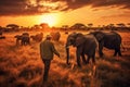 A man standing in savannah and looking at group of elephants generative AI