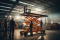 A man standing on a scissor lift in a warehouse, performing work at height, Workers install lighting fixture in a hug industrial Royalty Free Stock Photo