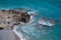 Man standing on the sea shore facing the waves Royalty Free Stock Photo