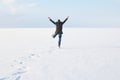 Man standing on the shore of a frozen sea downshifting way relax
