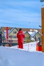 Man standing on a snow covered ground at a ski resort in Park City Utah