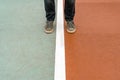 Man standing on the sports ground with white line between his legs Royalty Free Stock Photo