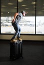 Funny man in airport with suitcase Royalty Free Stock Photo