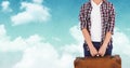 Man standing with suitcase bag against sky background Royalty Free Stock Photo