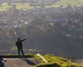 Man standing on the Te Mata Peak carpark, looking at the views of surrounding HawkeÃ¢â¬â¢s bay region