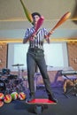 Man standing on top of cylinders and juggling glass bottles, one bottle broke. A series of drawings about the circus. Juggle clubs Royalty Free Stock Photo