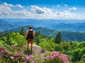 Man standing on top of the mountain enjoying beautiful view. Royalty Free Stock Photo