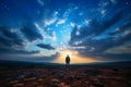 Man standing on top of a mountain and looking at the sunset. Royalty Free Stock Photo
