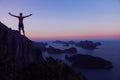 Man standing on the top of the mountain looking sunset at archipelago Royalty Free Stock Photo