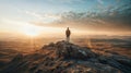 Man standing on the top of a mountain and looking at the sunset Royalty Free Stock Photo