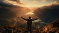 Man standing on top of the mountain, Man raising arms victoriously after climbing the mountain, Winner and Success concept Royalty Free Stock Photo