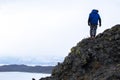 Man standing on top of rock mountain Royalty Free Stock Photo