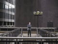 Man standing at top of steps looking up Royalty Free Stock Photo