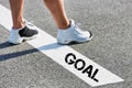 Man standing on white line with goal sign