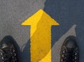 Man standing with yellow arrow move forward to future Royalty Free Stock Photo