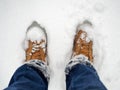 Man standing in yellow boots in snow Royalty Free Stock Photo