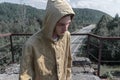 Man stands on an abandoned railway bridge.