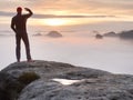 Beautiful moment the miracle of nature. Colorful mist in valley. Man hike. Person silhouette stand Royalty Free Stock Photo