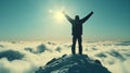 A man stands atop a mountain with his arms raised in victory above the clouds