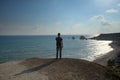 Man stands on the background of the Rock of Aphrodite
