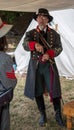 Man stands in Confederate officer uniform