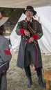 Man stands in Confederate officer uniform