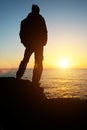 Man stands on the edge at sea Royalty Free Stock Photo