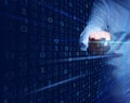 A man stands in front of a virtual screen with a binary code. Data verification, device and network control. Data protection, Royalty Free Stock Photo