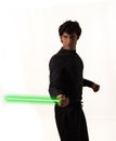 Man holding green lightsaber in right hand