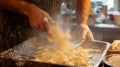 A man stands in a kitchen as he prepares pasta like Swabian Maultaschen or dumplings or ravioli