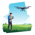 A man stands in a lush, green field operating a quadcopter drone with a controller. Th Royalty Free Stock Photo