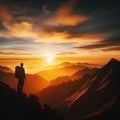 Man stands on mountain path with glorious sunset
