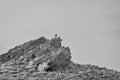 Man stands on a natural pyramid from plane stones