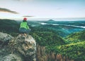 Man stands on the peak of rock. Hiker watching to autumn Sun at horizon . Beautiful moment Royalty Free Stock Photo