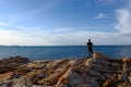 Man stands on a rock at Khao Laem Ya, Rayong, Thailand