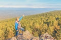A man stands on a rock and opens his arms in breadth Royalty Free Stock Photo