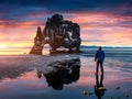 Man stands on the surface of water at fall of tide and and watch Royalty Free Stock Photo