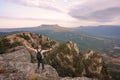 Man stands on the top of the Southern Demerdzhi Mountain in Crimea