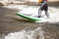 Man on Standup Paddle Board on a fast river. Royalty Free Stock Photo