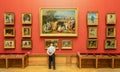 A man staring at the painting at the State Russian Museum in St. Petersburg