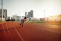 A man start running on track race at sport stadium Royalty Free Stock Photo