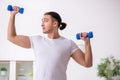 Young male starting day with morning exercises Royalty Free Stock Photo
