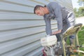 Man starting engine portable pressure washer Royalty Free Stock Photo