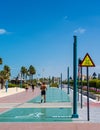 Man starting to jog along the running track alongside Dubai beach