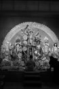 Man in a state of prayerful reverence in front of the altar of a Hindu temple to Lord Krishna