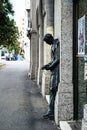 Man statue leaning on a wall on Zagreb street, Croatia